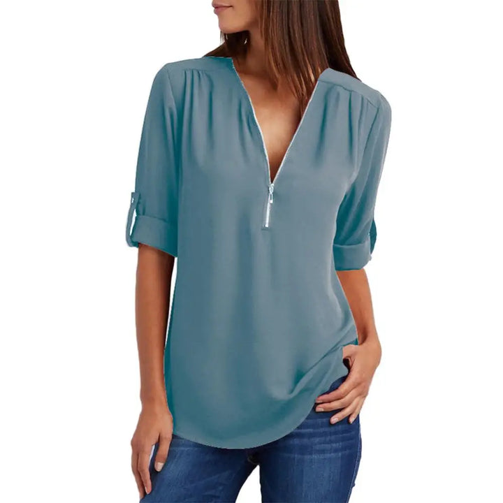 Blouse à col en V avec fermeture éclair et manches mi-longues
