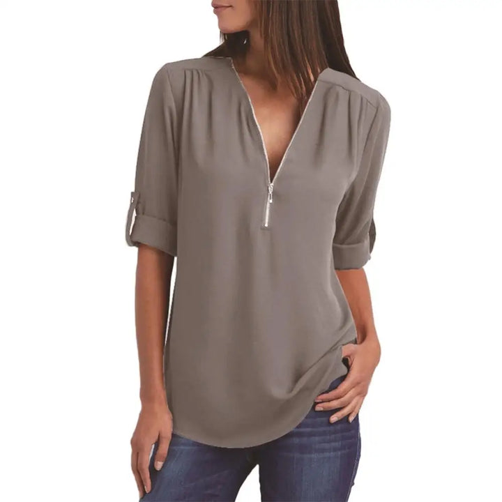 Blouse à col en V avec fermeture éclair et manches mi-longues