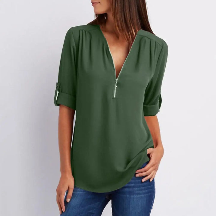 Blouse à col en V avec fermeture éclair et manches mi-longues